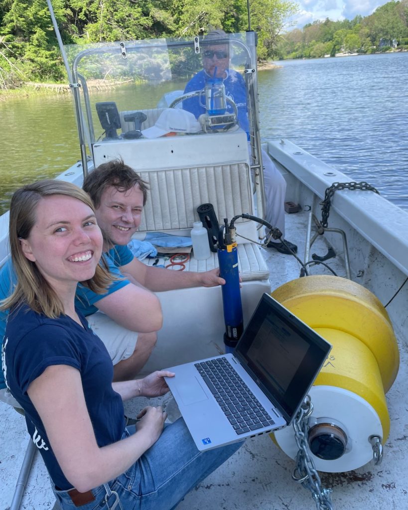 Lake Champlain/NEIWPCC staff performing water quality monitoring in a boat.