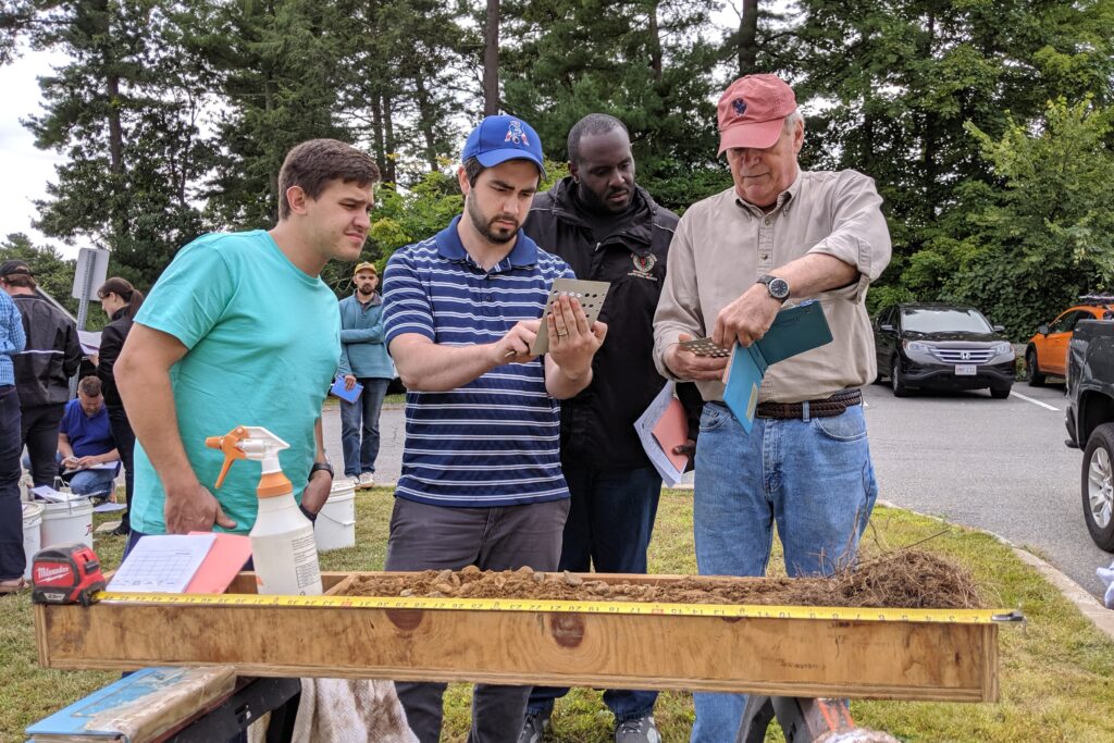 Men conducting soil evaluation
