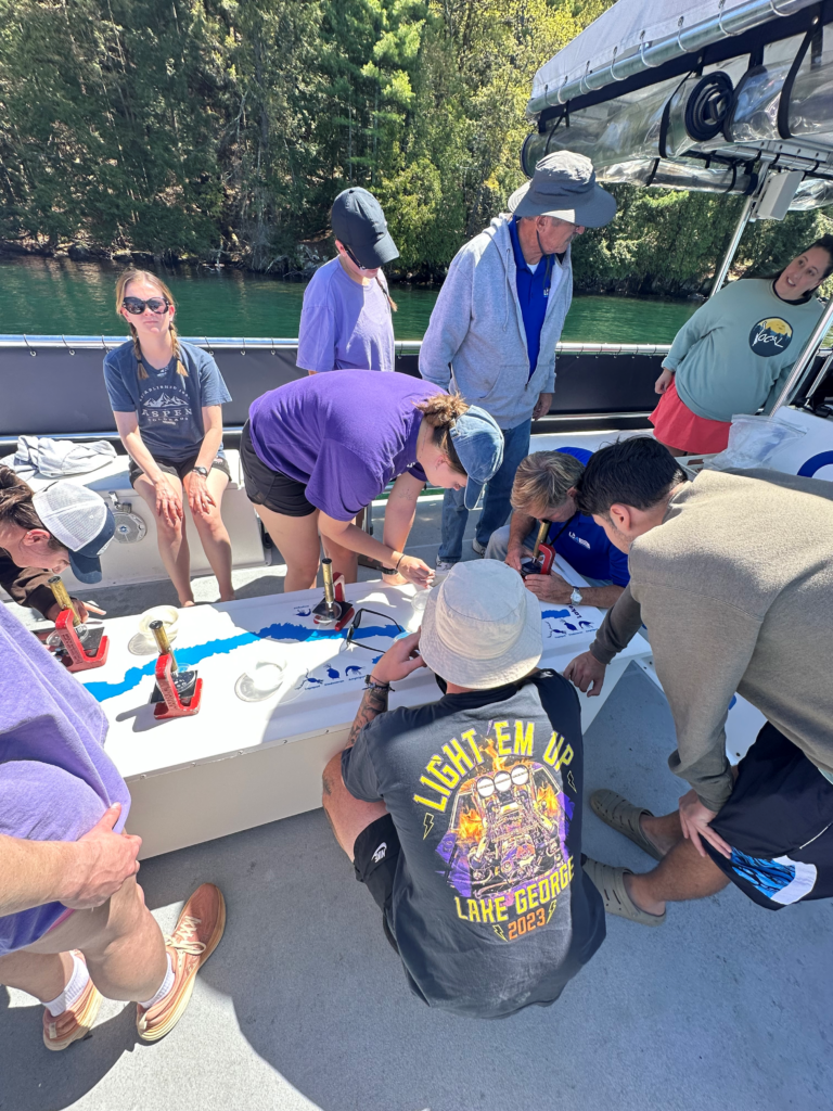 Floating classroom students investigate plankton tow samples.