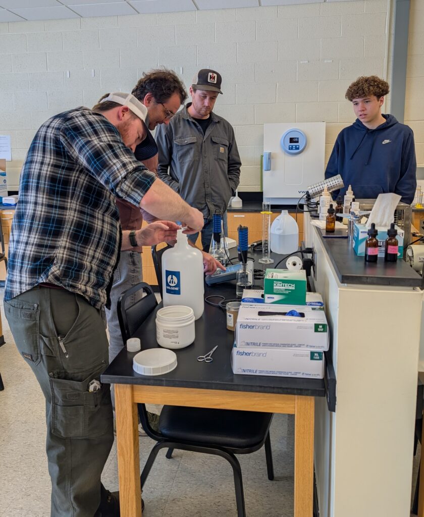Attendees learning about wastewater laboratory processes during the North Country Convention.