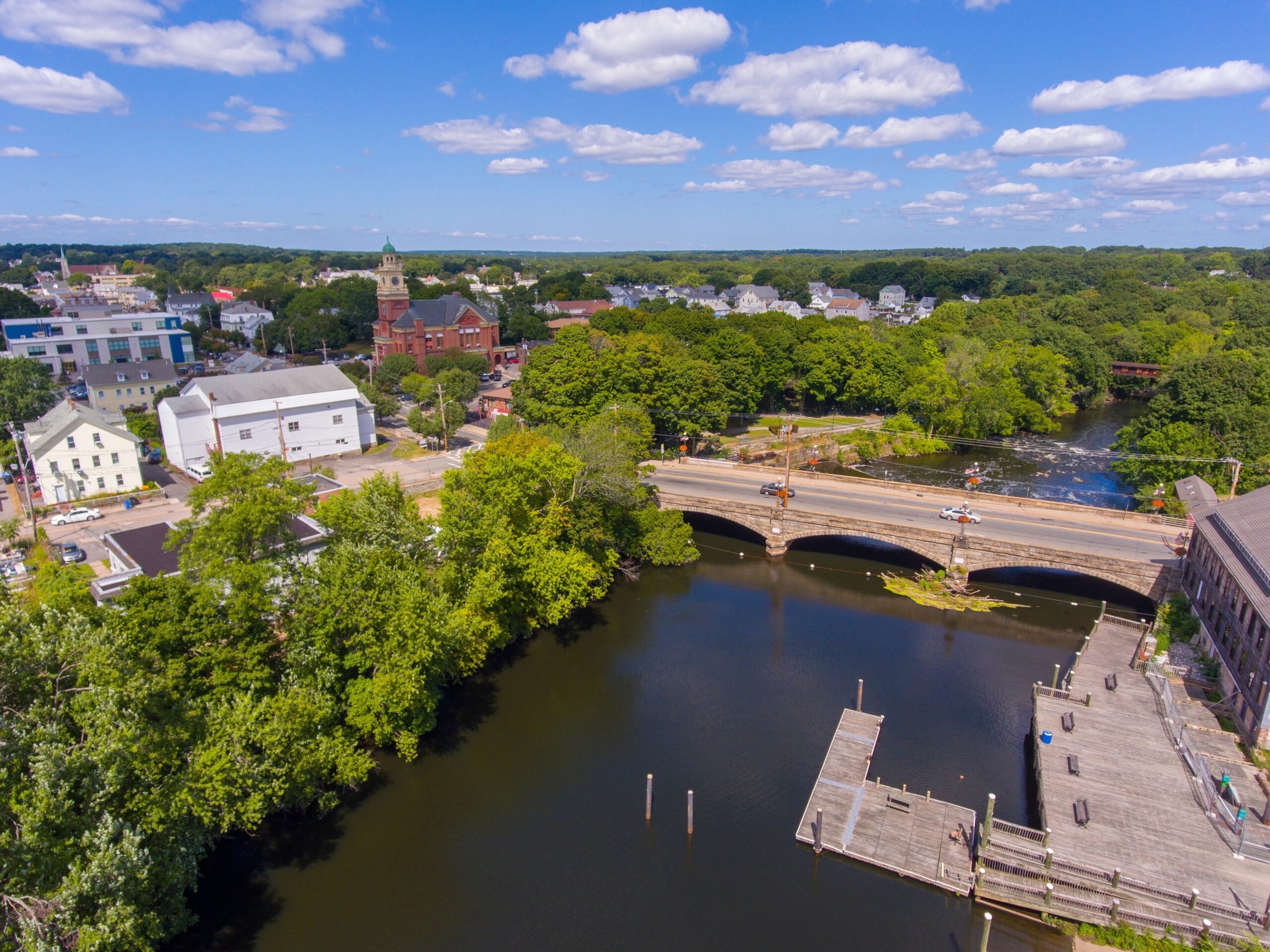 Three people monitoring a stream