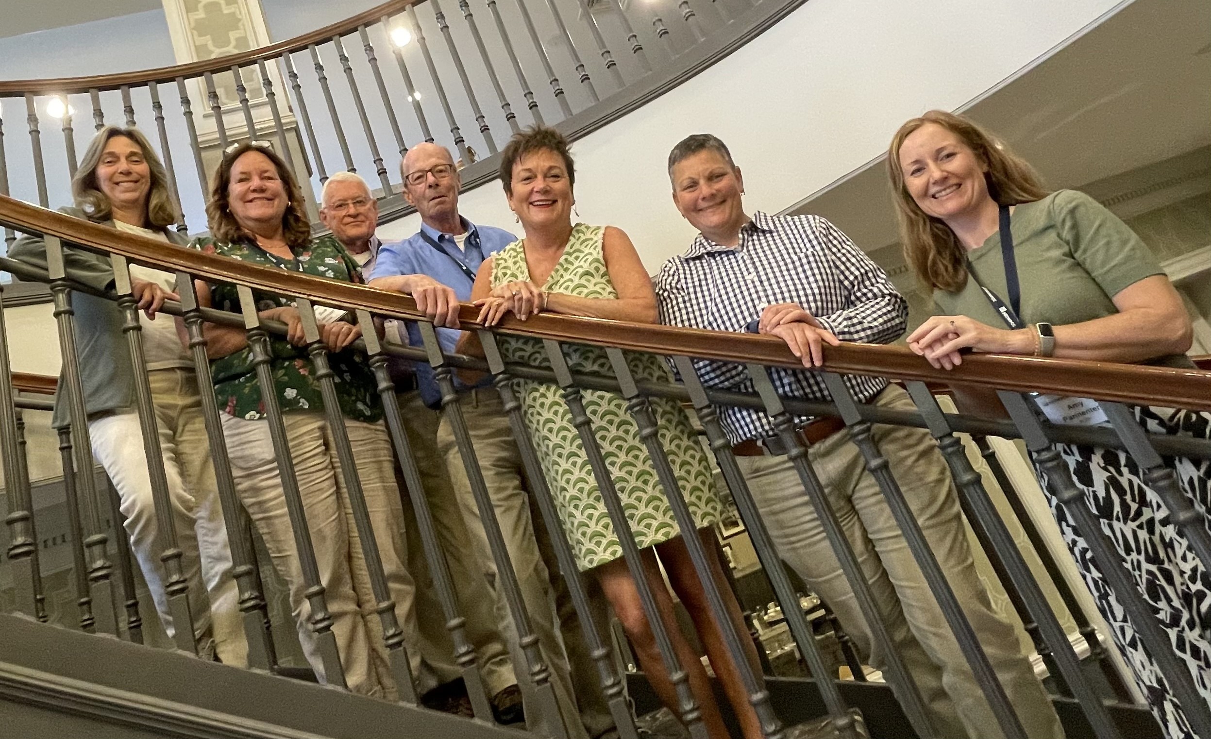 Three people monitoring a stream