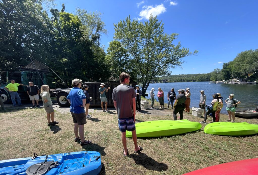 Community volunteers receive training before heading out on the water.