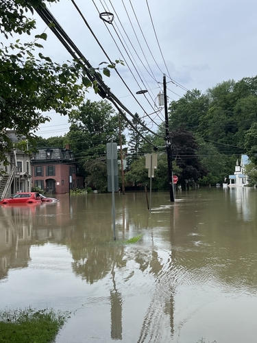 Flood waters overtake a street in Montpelier, Vermont.