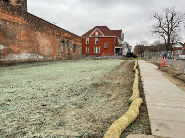 Figure 2. An abandoned gas station after being restored with topsoil and hydroseed (2024).