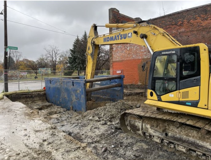 Figure 3. Contaminated soil being removed from an abandoned gas station using a trench box.