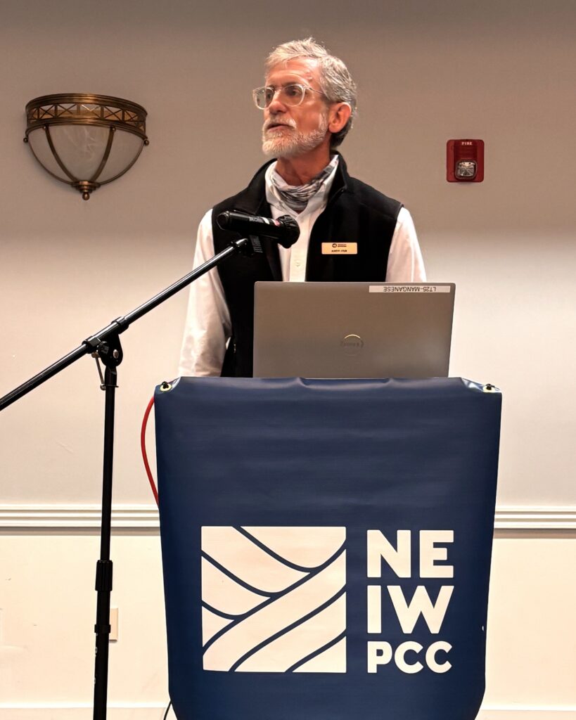 Northeast Regional Director of American Rivers, Andy Fiske, speaks at a podium about river restoration during his plenary address.
