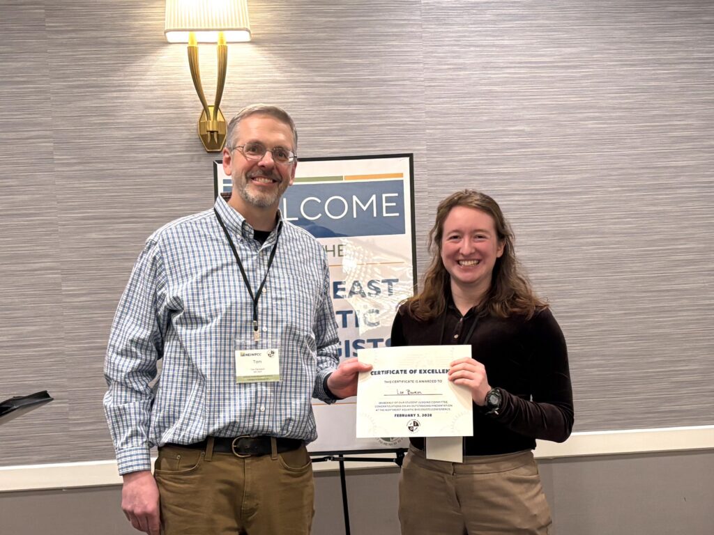 Tom Danielson, Maine Department of Environmental Protection, presents Lev Becker, University of Connecticut, the first place Student Oral Presentation Award at the annual NAB banquet.