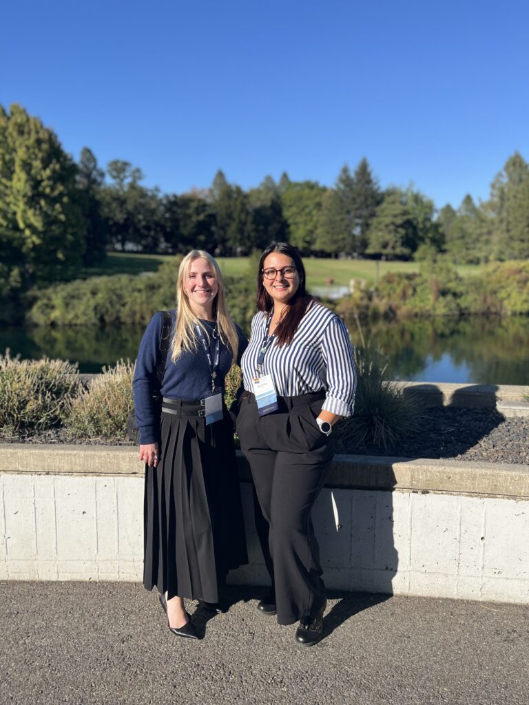 Kyla Foley and Katerina Pena standing outside and smiling at the camera.